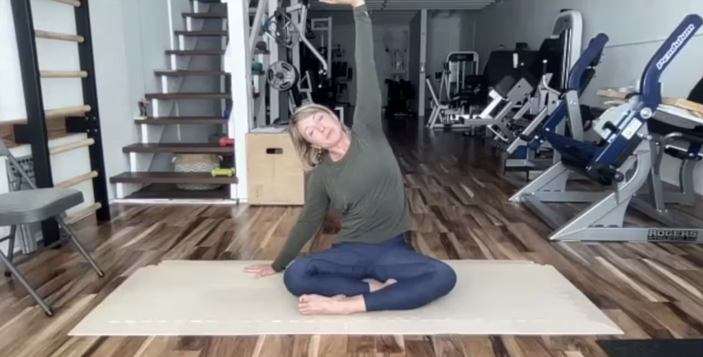 Woman doing Pilates exercises on the Pilates mat.