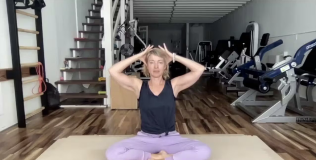 Woman doing Pilates exercises on the Pilates mat.