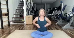 Woman doing Pilates exercises on the Pilates mat.