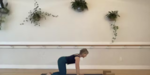 Woman doing Pilates exercises on the Pilates mat.