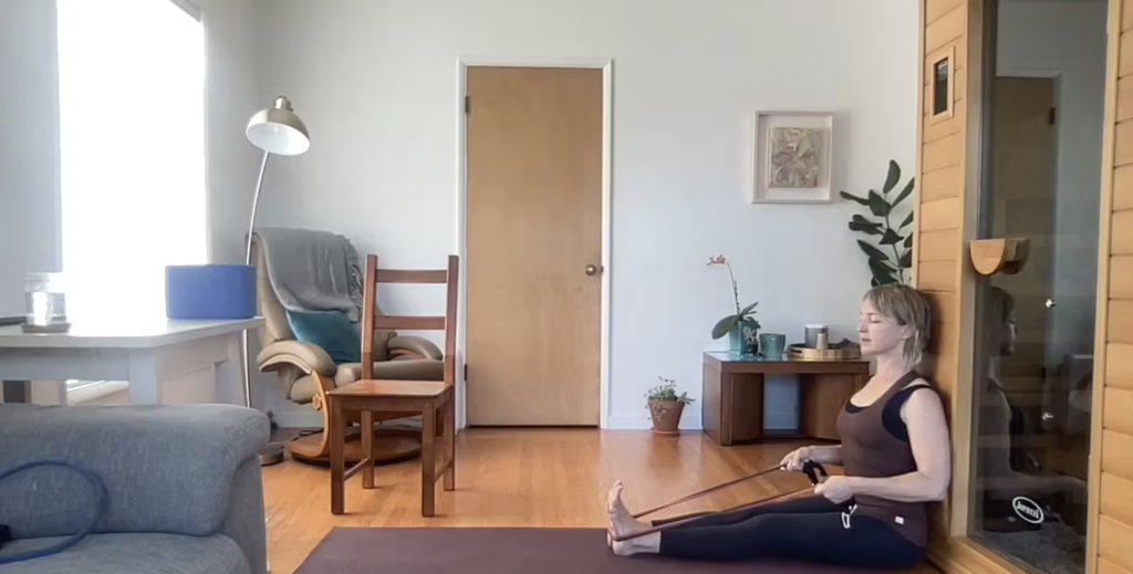 Woman doing Pilates exercises on the Pilates mat.