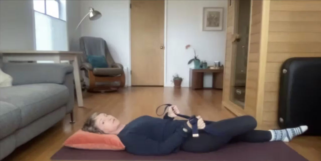 Woman doing Pilates exercises on her yoga mat.