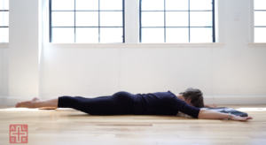 Woman doing Pilates exercises on a Pilates mat.