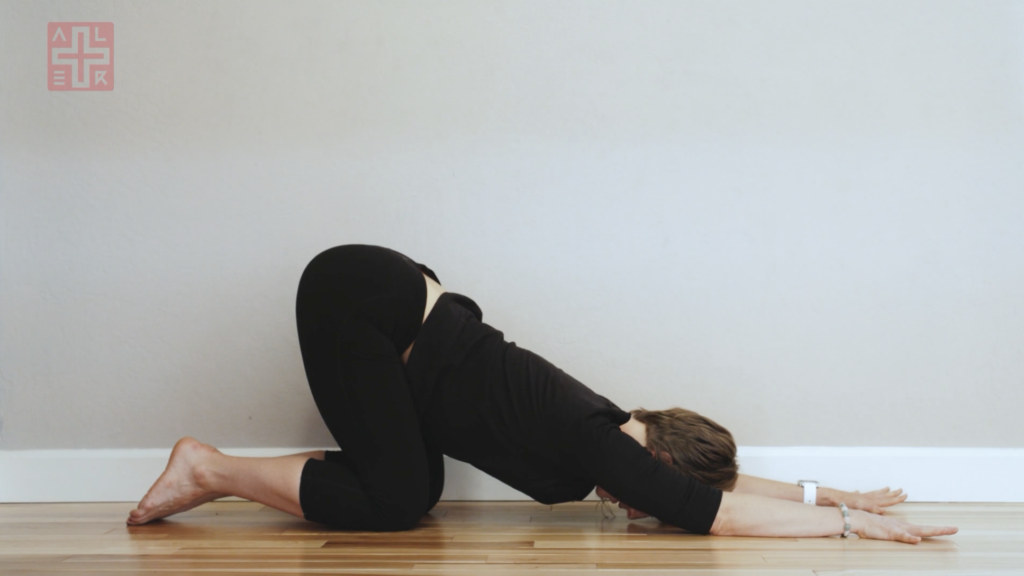 Woman doing yoga stretches.