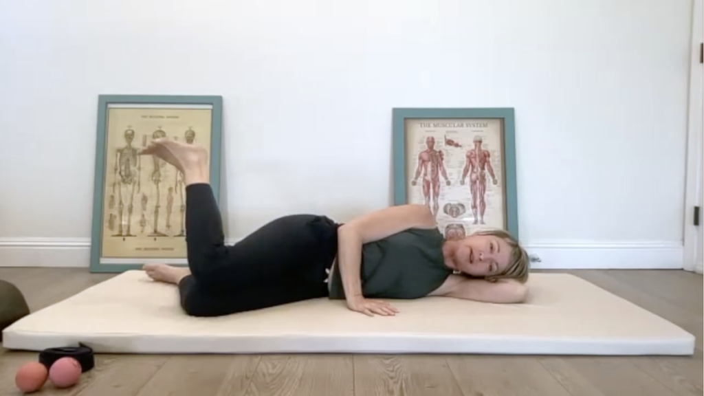 Woman doing Pilates exercises on a mat.