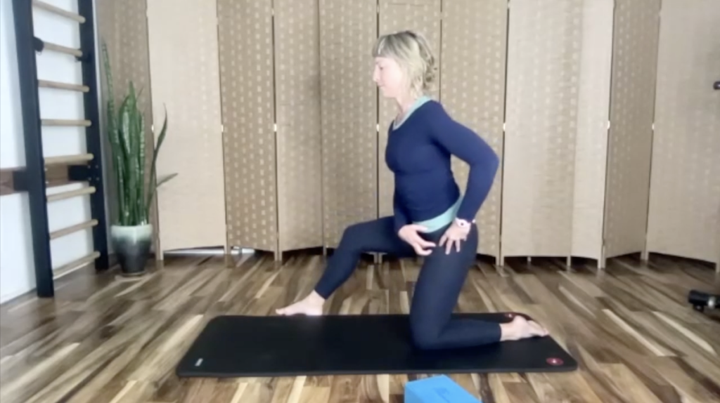 Woman doing Pilates exercises on a mat.