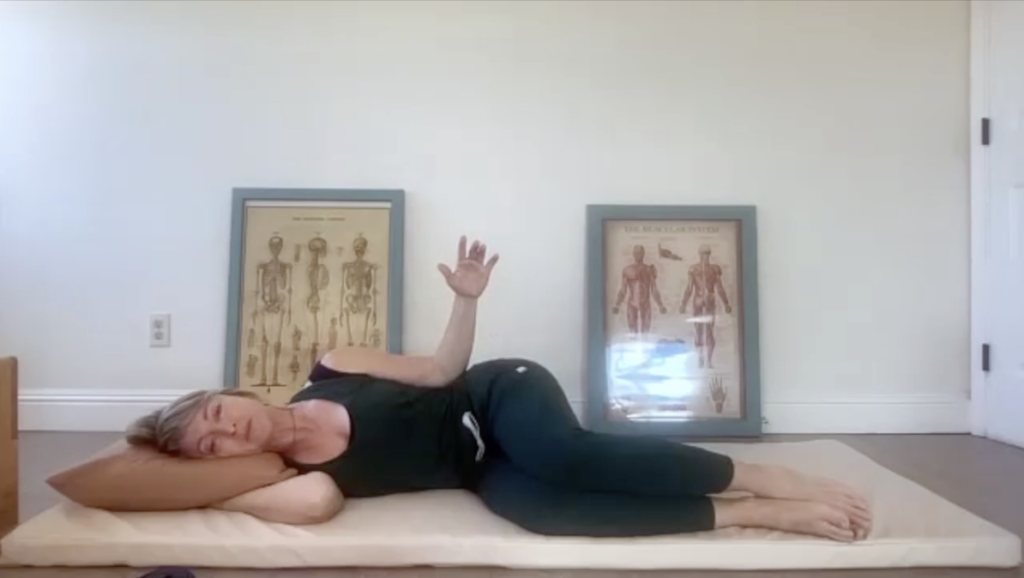 Woman doing Pilates exercises on a mat.