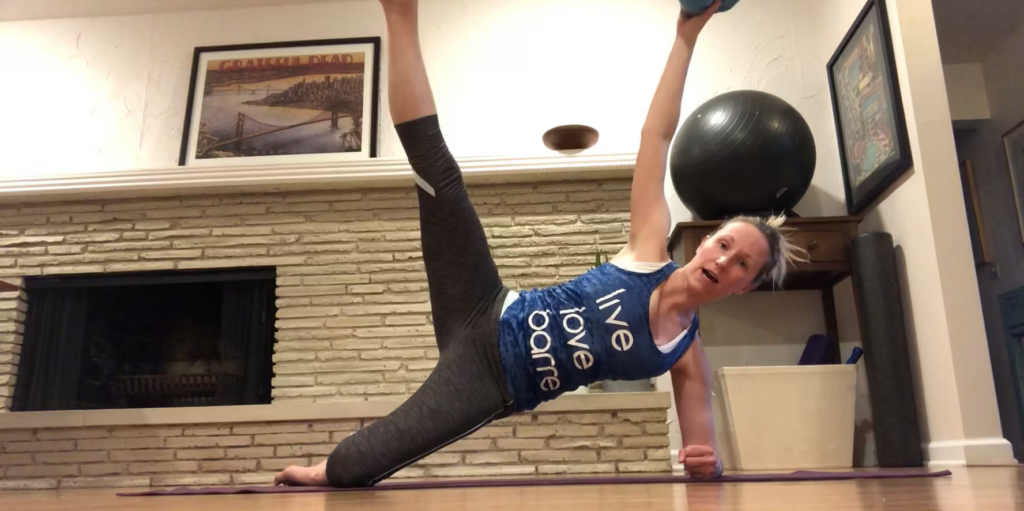 Woman doing Pilates exercises on the Pilates mat.