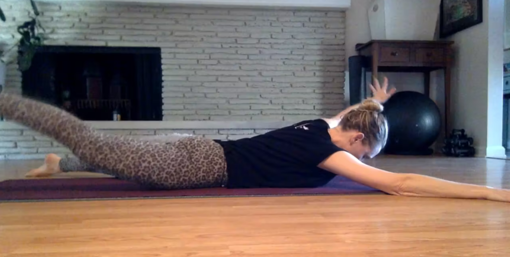 Woman doing Pilates exercises on the Pilates mat.