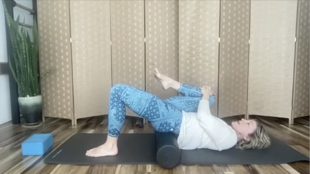 Woman doing Pilates exercises on a mat.