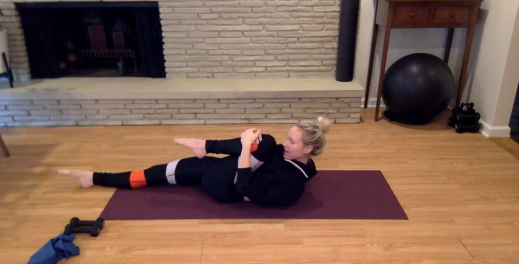 Woman doing Pilates abdominal exercises on the Pilates mat.