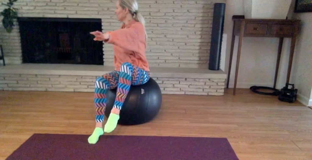 Woman doing Pilates exercises on a Pilates ball.