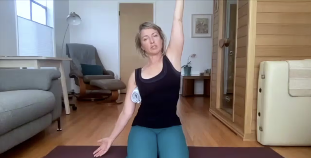 Woman doing Pilates exercises on the Pilates mat.