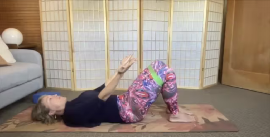 Woman doing Pilates exercises on the Pilates mat.