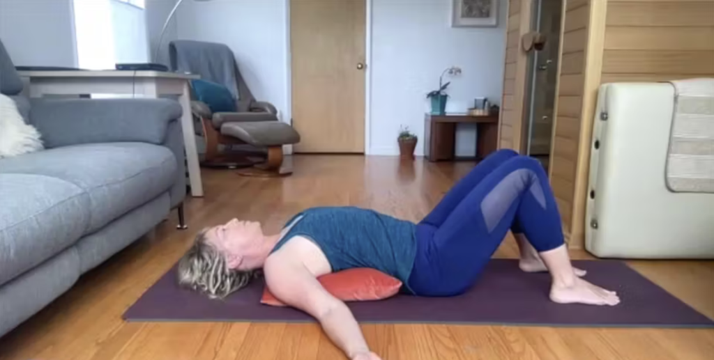 Woman doing Pilates exercises on the Pilates mat.