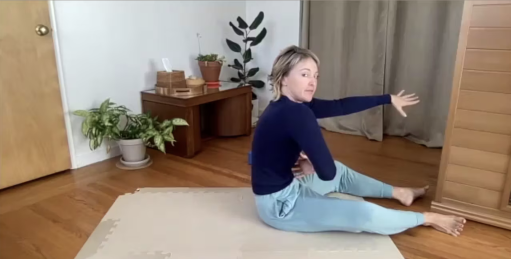 Woman doing Pilates exercises on the Pilates mat.