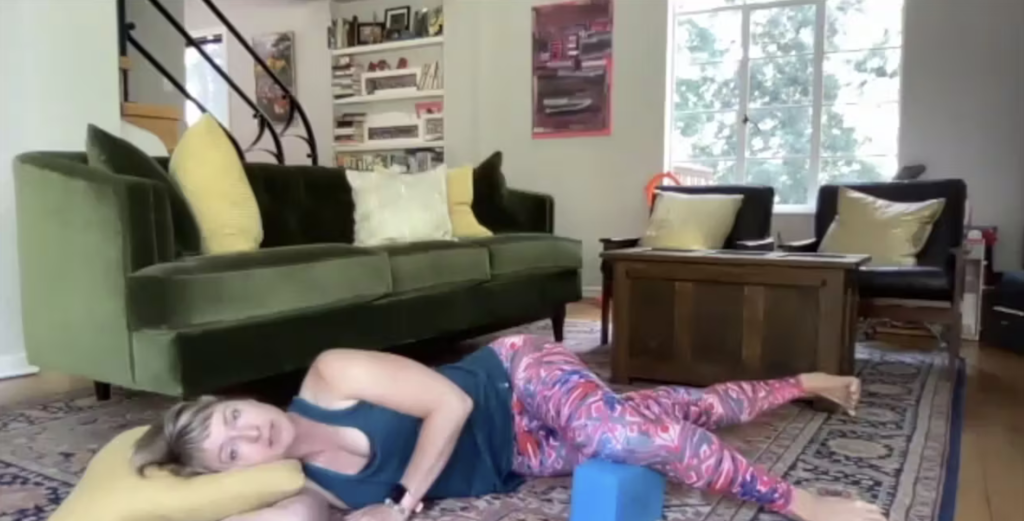 Woman doing Pilates exercises on the Pilates mat.