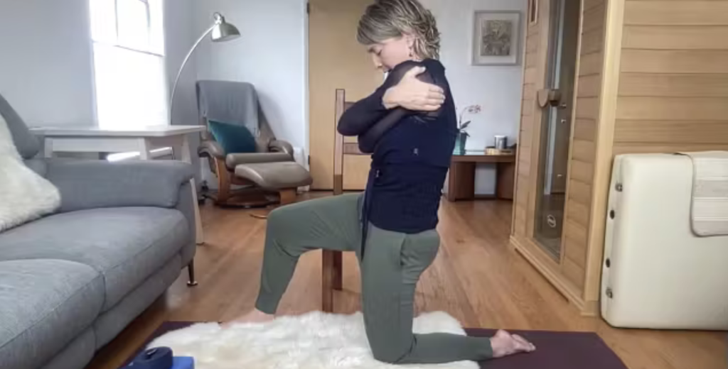 Woman doing Pilates exercises kneeling.