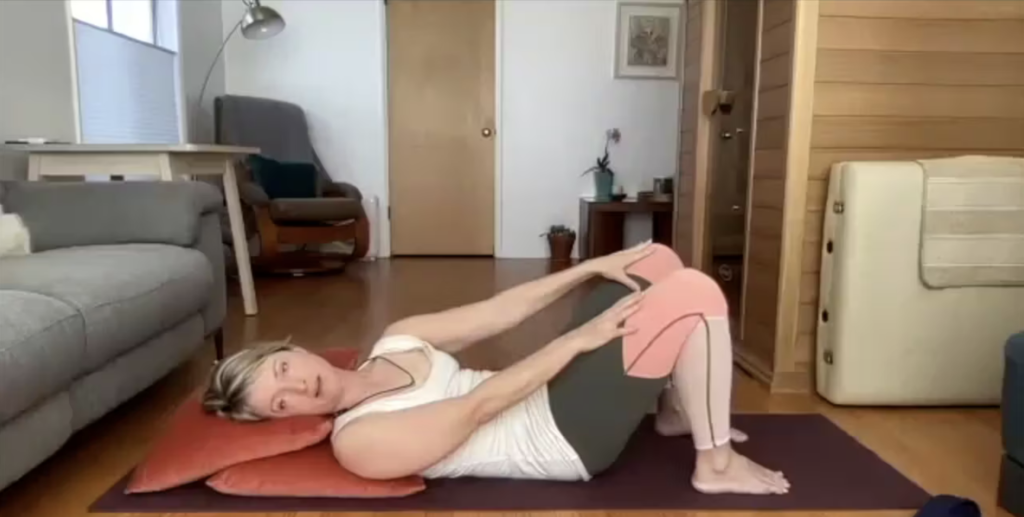 Woman doing Pilates exercises on the Pilates mat.