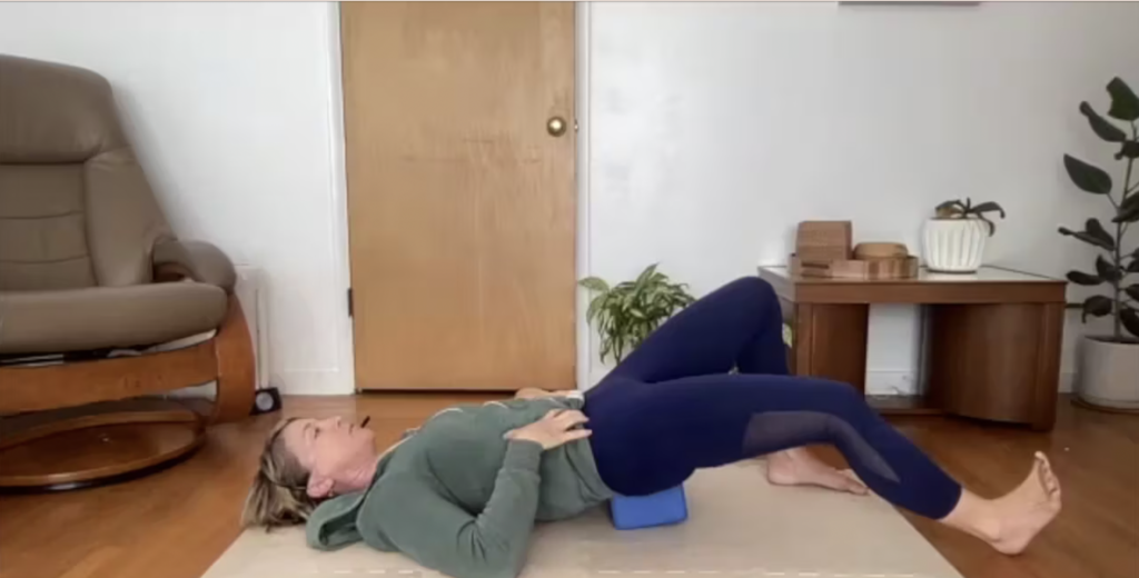 Woman doing Pilates exercises on the Pilates mat.