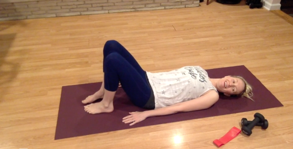 Woman doing Pilates exercises on a Pilates mat.