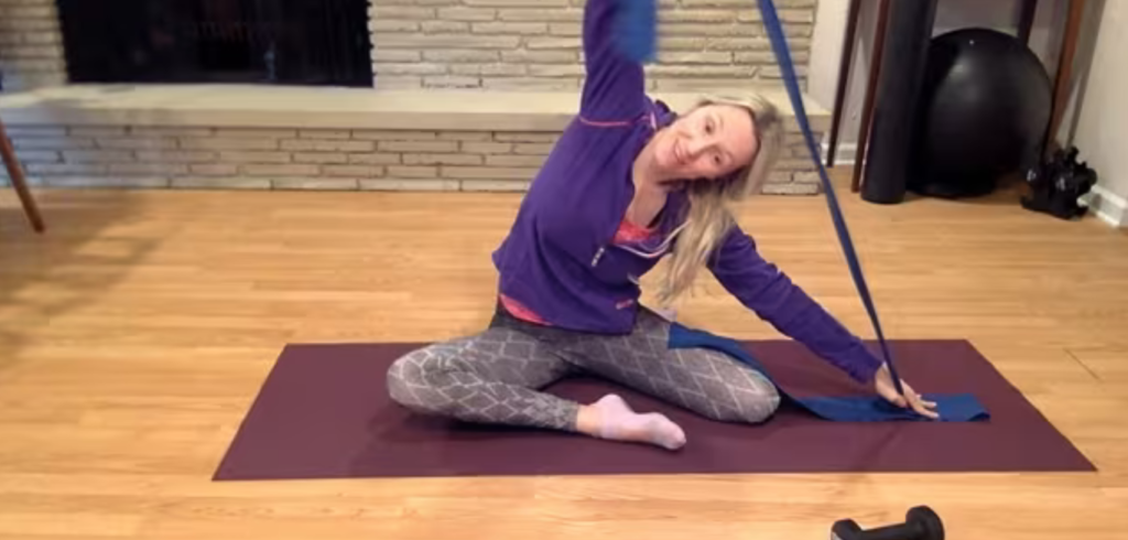 Woman doing Pilates abdominal and arm exercises