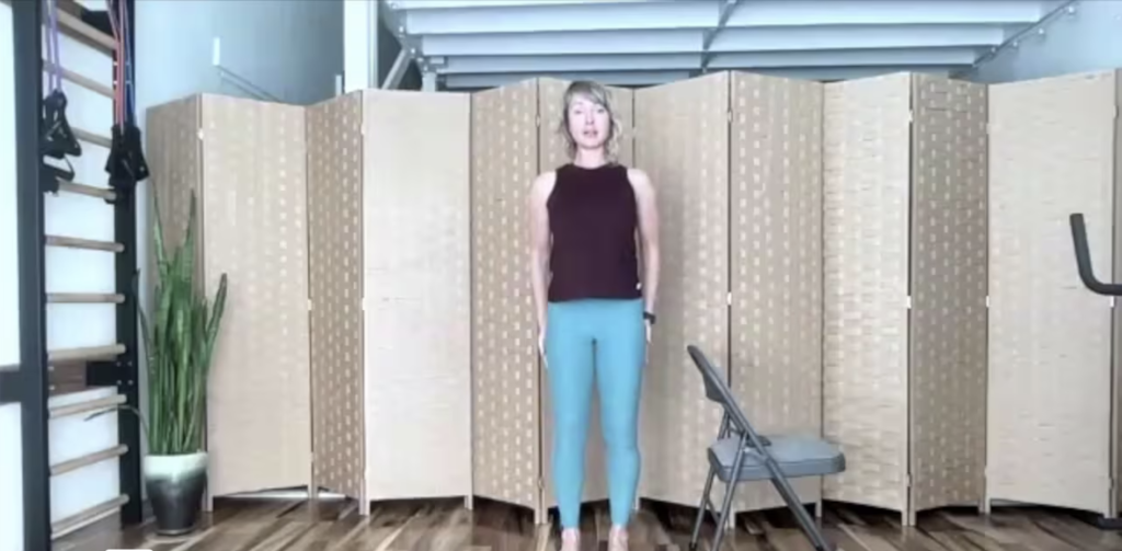 Woman standing doing Pilates and barre exercises to strengthen the legs