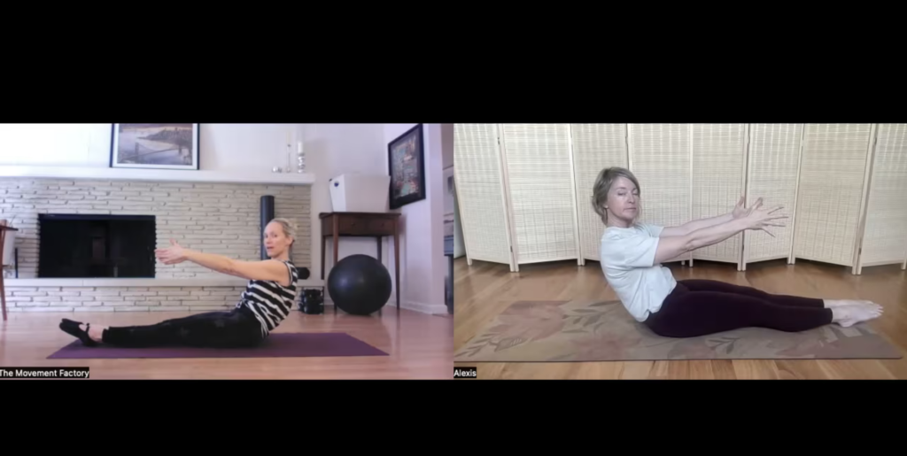 Two women on Pilates Mats doing an abdominal exercise
