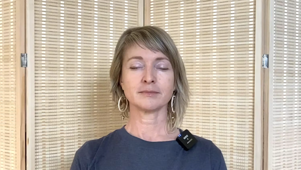 Close up of woman's face doing breathing exercises