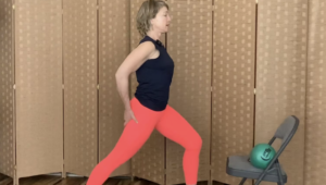 Woman standing doing Pilates lunge exercises