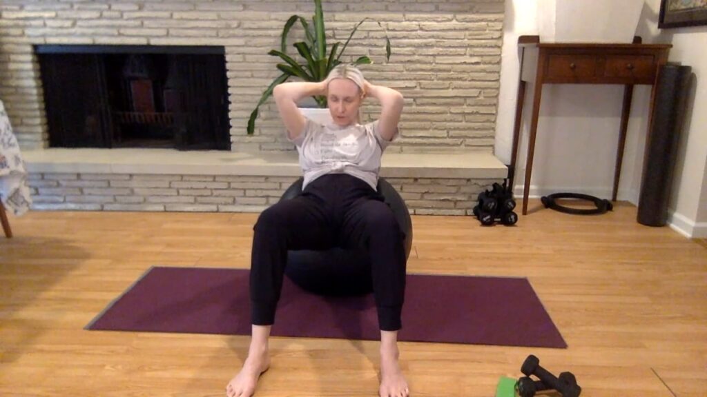 Woman doing pilates exercises on a pilates ball.