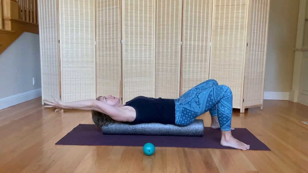 Pilates mat on foam roller for posture