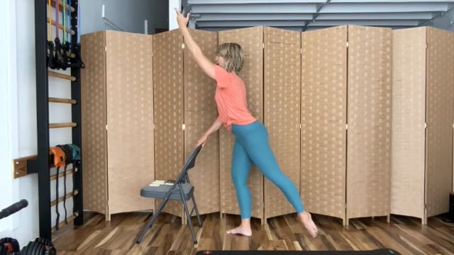 Woman practicing ballet barre exercise