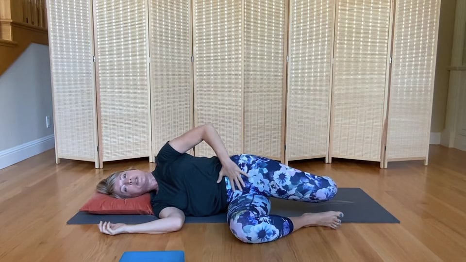 A woman doing functional core exercises on a mat