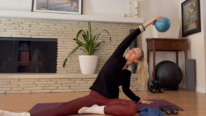 woman stretching with pilates class