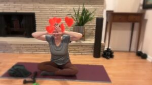 woman doing pilates arm exercises