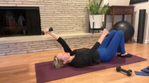 Woman doing Pilates on the floor