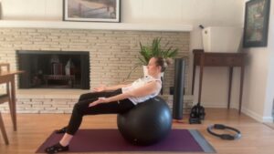 woman doing ab exercises on the pilates ball